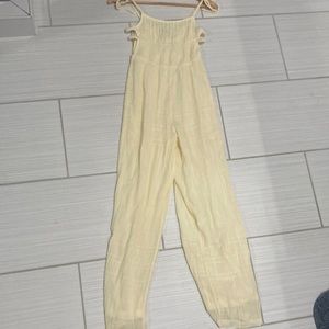 Yellow Urban Outfitters jumper, with open sides and tie straps.